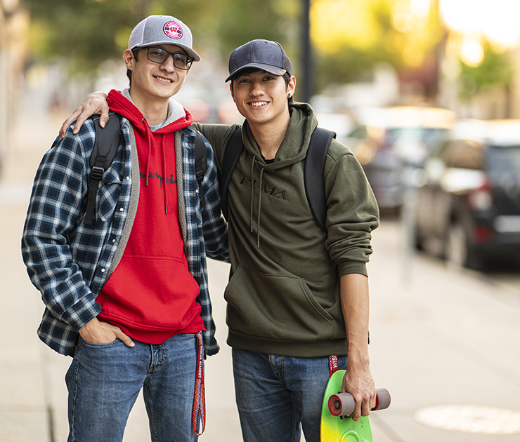 Outdoor portrait of brothers Gavin and Mason White Eagle, undergraduate recipients of the Tribal Education Promise Program