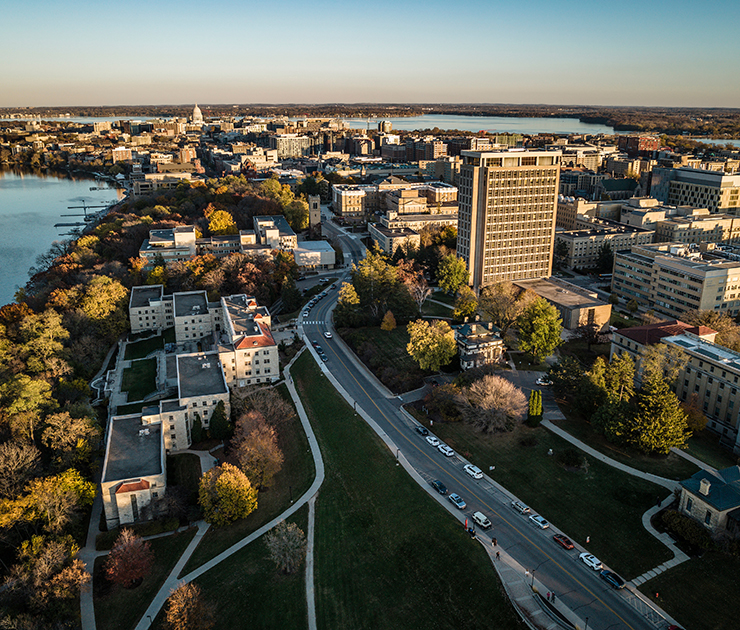 Aerial view of UW–Madison campus and the Madison skyline. Lake Mendota and Lake Monona are photographed looking east