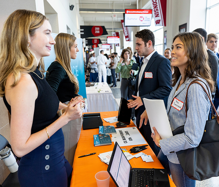 UW–Madison student speaking with a recruiter at a career fair