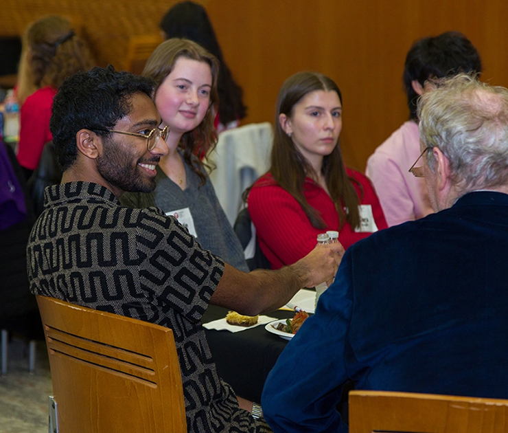 Group of dinner attendees talking